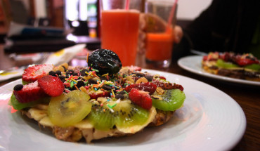 A sweet waffle bursting with fruits, nuts and creamy spreads.